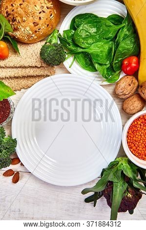 Selection Food Rich In Fiber On White Wooden Background Around Empty Plate
