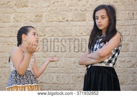 Two Girls Who Have Fallen Out Being Upset With Each Other. Taken In Witney, Oxfordshire In The Uk On