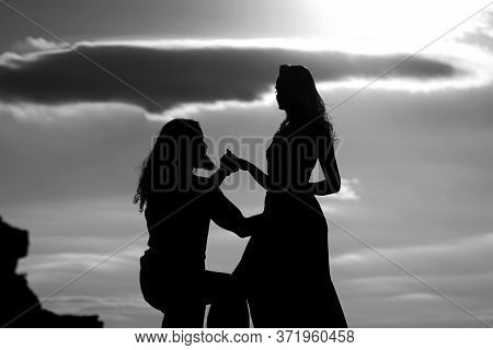 Shadow Figures Of Man And Woman Holding Hands. Love And Relations. Silhouettes Of Love Couple Man An