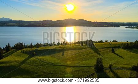 Aerial View Over Lake Forggensee At The City Of Fuessen In Bavaria Germany