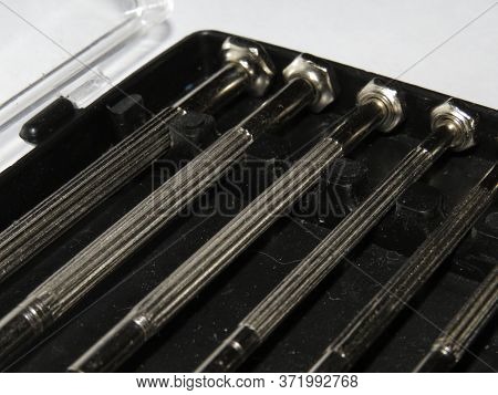 Set Of Philips And Slot Screwdrivers With Yellow And Black Plastic Handles.