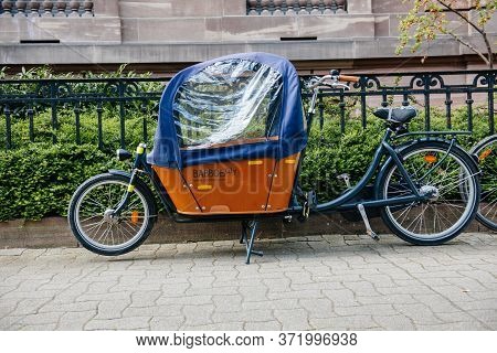 Paris, France - Mar 16, 2014: New Babboe City Parked On Empty Street An Agile And Flexible Cargo Bik