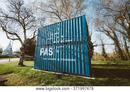 Strasbourg, France - Mar 18, 2020: Side Low Angle View Of Cargo Containers Painted In Blue Color And
