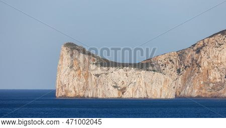 Rocky Cliffs On The Sea Coast. Sardinia, Italy. Nature Background