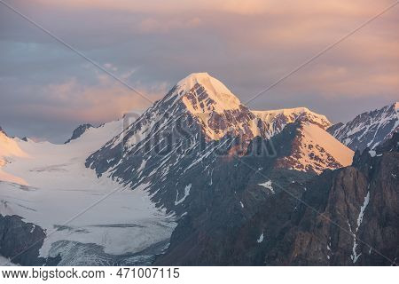 Scenic Aerial View To High Snow Mountains In Early Morning At Dawn. Awesome Scenery With Sunlit Gold