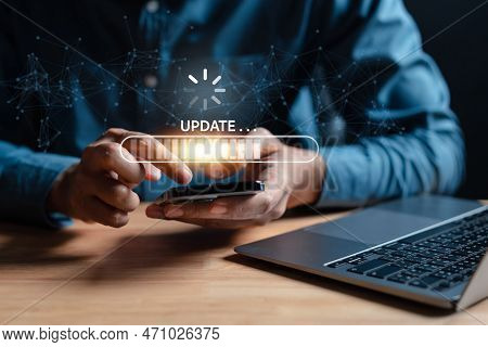 Update Software System In Computer. Man Using Smartphone Upgrade Program, Business Technology Intern