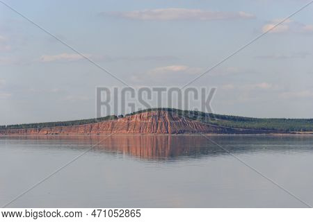 Lake With A Mountain Reflection, Red Hill With Forest On Background