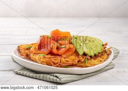 Fried Potato Pancakes With Salmon And Sour Cream, Fritter, Roesti, Golden Crispy Crust. Traditional 