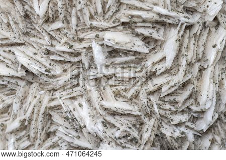 Small Cube-shaped Crystals Of Pyrite On Milk-white Barite. Natural Minerals As Background