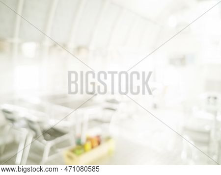 White Blurred Background Bright Restaurant Shopping Mall Silver Gray Lighting. Defocused Store Light