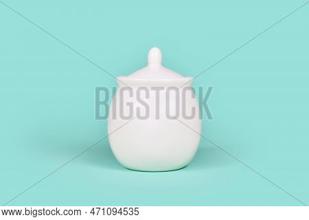 White Sugar Bowl On Mint Green Background
