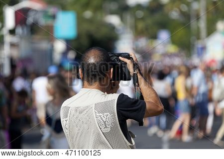 Saint-gilles Les Bains, La Réunion - June 25 2017: Photojournalist Taking A Picture Of The Crowd Dur