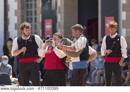 Morlaix, France - July 18 2021: A Bagad (breton Band) In Traditional Costume Playing Bombards And Bi