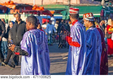 Marrakesh, Morocco - January 28 2019: Group Of Musicians In Traditional Costume Playing Krakebs In D