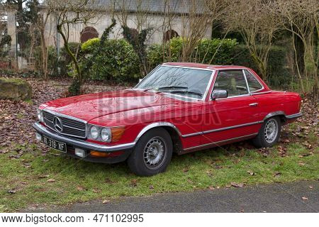 Lamorlaye, France - January 01 2020: Old Mercedes-benz 280sl Parked By The Bushes.