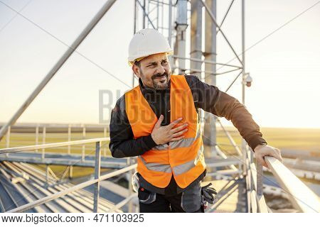 A Heavy Industry Worker Feeling Dizzy And Nauseous Because Of Big Height On Silo.