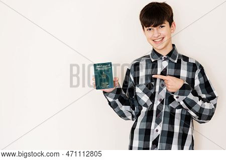 Young Teenager Boy Holding Tunisia Passport Looking Positive And Happy Standing And Smiling With A C