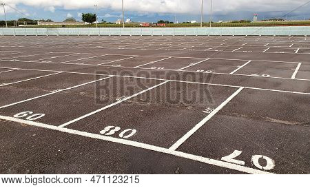 Empty Parking Lot - Numbered Parking Spaces In Drive-in
