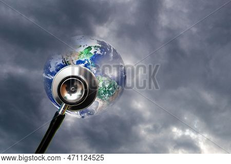 Globe Health And Stethoscope Diagnose On Dramatic Sky Cloudy Background.concept For Global Medicine.