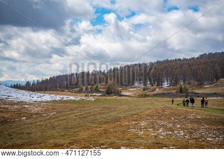 People On Historic Kurgan Or Tumulus, Grave Mound In Tschuja Steppes, Altai Republic, Siberia, Russi