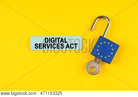 On A Yellow Surface, An Open Padlock With The Image Of The Flag Of The European Union With A Key And
