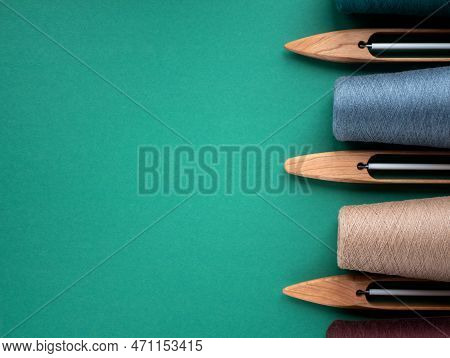 Wooden Boat Shuttles For Handloom And Cones With Yarn Of Neutral Tones, Copy Space. Concept Of Weavi