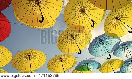 Colorful Umbrellas Background. Colorful Umbrellas In Blue Sky. Street Decoration