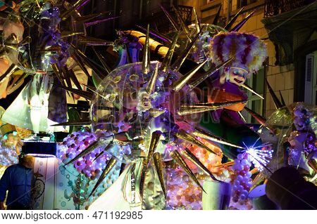 Aalst, Belgium, 19 February 2023: Brightly Illuminted Floats With People Participating In Aalst Mard