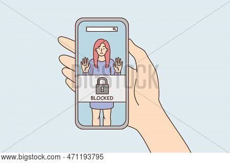 Phone In Hand With Photo Of Woman And Inscription Blocked Due To Unacceptable Behavior. Portrait Gir