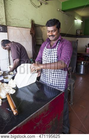 Pondicherry, India - December 2019, Circa. Unidentified Man In Restaurant Doing Parotta Bread For Lu