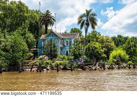 Boat Tour On The Parana Delta, Tigre, Buenos Aires, Argentina. Lush Vegetation, Palm Trees, Construc