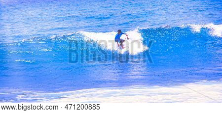 Hossegor, France - February Circa , 2019. An Unidentified Surfer Man Catching Riding On An Ocean Wav