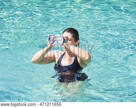 Family Mother Caucasian Woman Wearing Mask Swimming In The Pool. Happy Holiday Concept. Cute Happy L