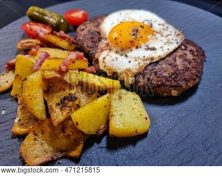 Hacksteak A La Meier Beefsteak With  Fried Eggs And Roasted Potatoes