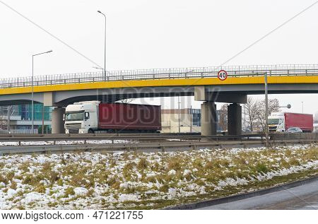 Trucks Drive Under The Transport Bridge. Transport Logistics.