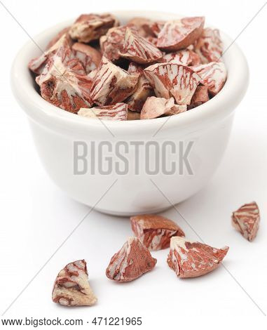 Betel Nut In A Bowl Over White Background