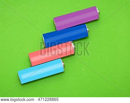 Rechargeable Colorful Lithium Batteries On Green Background