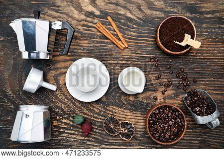 Cup Of Coffee, Geyser Coffee Maker, Milk And Beans Coffee On, Dark Wooden Table. Top View.