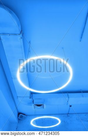 Ceiling With Round Modern Led Lamps. Suspended Fluorescent Lights Under The Ceiling. Careful Energy 