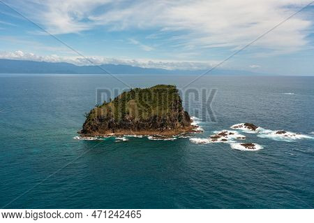 Aerial Drone Of Rocky Island In The Ocean And Sea Surf. Santa Ana, Cagayan. Philippines.
