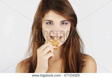Portrait Of Young Woman Eating Cookie