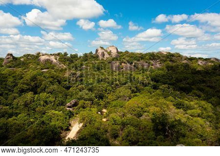 Aerial View Of Rocks Among The Rainforest And Jungle Against The Blue Sky And Clouds. Sri Lanka, Oka