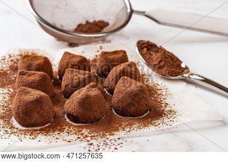 Chocolate Truffles Sprinkled With Cocoa Powder Closeup. Delicious Dark Chocolate Candy Balls, Mesh S