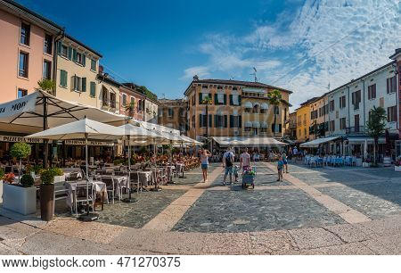 Sirmione, Lake Garda, Lombardy, Italy - August 11, 2020 - Tourists Visiting The Popular Historic Att