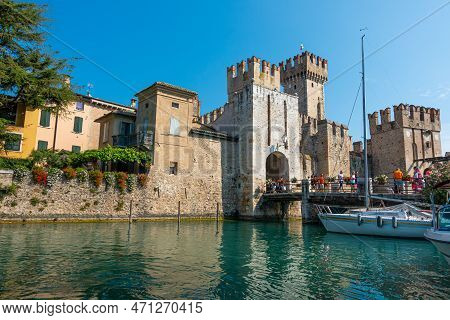 Sirmione, Lake Garda, Lombardy, Italy - August 11, 2020 - Tourists Visiting The Popular Historic Att