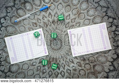 Two Friends, Men And Women Are Playing Yamb Game In Their Free Time In The  Spring Garden