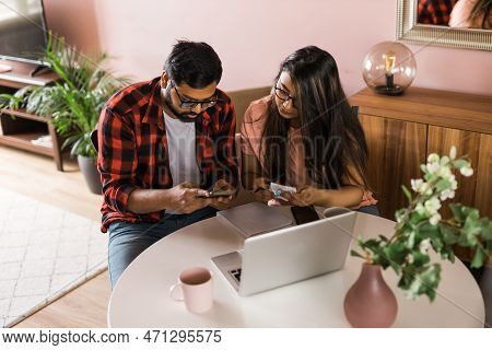 Serious Wife And Husband Planning Budget, Checking Finances, Focused Young Woman Using Online Calcul