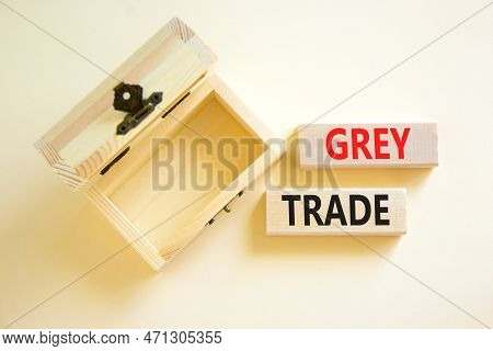 Grey Trade Symbol. Concept Words Grey Trade On Wooden Block. Beautiful White Table White Background.