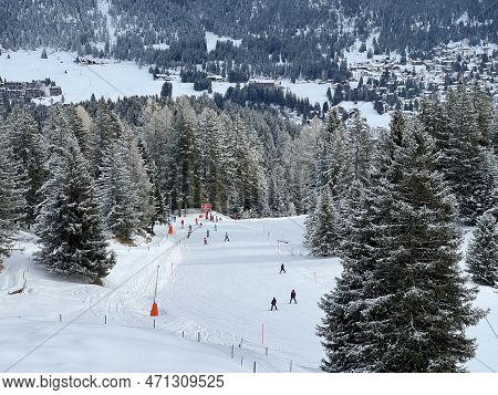 Snowboard And Ski Trails Or Alpine Trails For Winter Sports Above The Tourist Resorts Of Valbella An