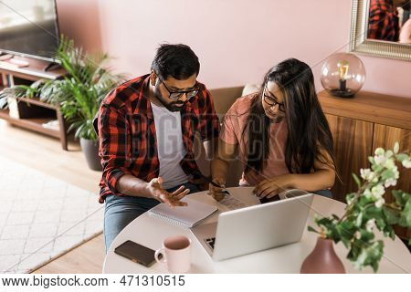 Serious Wife And Husband Planning Budget, Checking Finances, Focused Young Woman Using Online Calcul